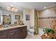 Spa-like bathroom with granite vanity, tiled shower, and soaking tub at 795 Collany Rd # 304, St Petersburg, FL 33715