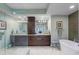 Bathroom with double vanity, large mirror, and soaking tub at 795 Collany Rd # 304, St Petersburg, FL 33715