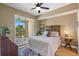 Charming bedroom with wooden bed frame and access to balcony at 795 Collany Rd # 304, St Petersburg, FL 33715