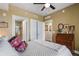 Comfortable bedroom with ensuite bathroom access and vintage dresser at 795 Collany Rd # 304, St Petersburg, FL 33715