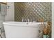 Elegant freestanding bathtub with unique tile surround at 795 Collany Rd # 304, St Petersburg, FL 33715