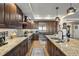 Granite countertops and stainless steel appliances in this well-lit kitchen at 795 Collany Rd # 304, St Petersburg, FL 33715