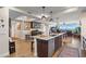 Open kitchen with island and breakfast bar overlooking living area at 795 Collany Rd # 304, St Petersburg, FL 33715