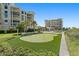 Community putting green with landscaping at 795 Collany Rd # 304, St Petersburg, FL 33715