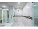 Luxurious walk-in shower with marble tile and dual shower heads at 795 Collany Rd # 304, St Petersburg, FL 33715