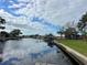 Scenic canal-front view with boats and lush landscaping at 9644 Oak Ne St, St Petersburg, FL 33702