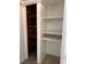 Closet with wooden and white shelves at 1000 Country Club N Rd, St Petersburg, FL 33710