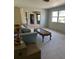 Bright living room featuring a light-colored sofa and coffee table at 1000 Country Club N Rd, St Petersburg, FL 33710