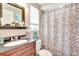 Bathroom featuring vanity sink, floral shower curtain and decor at 109 San Rafael Ave, North Port, FL 34287