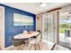 Charming dining area features a modern table set and sliding glass doors to the exterior at 109 San Rafael Ave, North Port, FL 34287