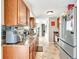 Kitchen features granite counters, wood cabinets, and stainless steel appliances at 109 San Rafael Ave, North Port, FL 34287