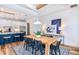 Light-filled dining area with a wood table, blue accents, and a white brick feature wall at 11441 Waterway Dr, Parrish, FL 34219