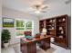 Home office with built-in wooden shelves and a large desk at 133 Angol St, Punta Gorda, FL 33983