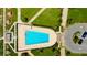 Aerial view of the community pool, landscaping, and beach seating, creating a resort-like atmosphere for residents at 1430 Gulf Blvd # 204, Clearwater Beach, FL 33767