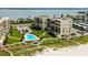 Beachfront condos with lush landscaping, private beach access, and a community pool at 1430 Gulf Blvd # 204, Clearwater Beach, FL 33767