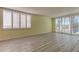 Sunny room with shuttered windows and light wood floors offer plenty of natural light at 1430 Gulf Blvd # 204, Clearwater Beach, FL 33767