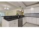 Updated kitchen with stainless steel appliances, modern cabinetry, and granite counters at 1430 Gulf Blvd # 204, Clearwater Beach, FL 33767