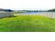 Spacious backyard with lake view and fenced area at 15410 Miller Creek Dr, Ruskin, FL 33573