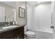 Bathroom with tub, single vanity, and granite countertop at 15410 Miller Creek Dr, Ruskin, FL 33573