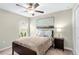 Bedroom with double bed, ceiling fan, and nightstand at 15410 Miller Creek Dr, Ruskin, FL 33573