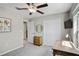 Bedroom with desk, ceiling fan, and built-in closet at 15410 Miller Creek Dr, Ruskin, FL 33573