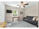 Bedroom with sofa bed, desk, and ceiling fan at 15410 Miller Creek Dr, Ruskin, FL 33573