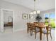 Bright dining room with wooden table and access to backyard at 15410 Miller Creek Dr, Ruskin, FL 33573