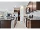 Modern kitchen featuring stainless steel appliances and granite countertops at 15410 Miller Creek Dr, Ruskin, FL 33573