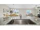 Kitchen sink with granite countertop and view to dining area at 15410 Miller Creek Dr, Ruskin, FL 33573