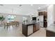 Open concept kitchen and dining area with water views at 15410 Miller Creek Dr, Ruskin, FL 33573