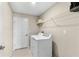 Laundry room with washer, dryer, and overhead shelving at 15410 Miller Creek Dr, Ruskin, FL 33573