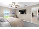 Main bedroom with ensuite and view to backyard and lake at 15410 Miller Creek Dr, Ruskin, FL 33573