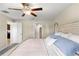 Main bedroom with ensuite bathroom and ceiling fan at 15410 Miller Creek Dr, Ruskin, FL 33573