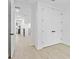 Light hallway with white doors and wood floors at 1801 N Morgan St # 13, Tampa, FL 33602