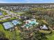 Aerial view showing community amenities including pool, tennis courts, and clubhouse at 19270 Briarbrook Dr, Tampa, FL 33647