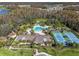 Community clubhouse with pool, tennis courts, and playground visible from above at 19270 Briarbrook Dr, Tampa, FL 33647