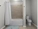 Bathroom with shower/tub combo and tile surround at 19270 Briarbrook Dr, Tampa, FL 33647