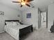 Bright bedroom with plush carpet and ceiling fan at 19270 Briarbrook Dr, Tampa, FL 33647