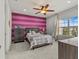 Bedroom with pink and gray color scheme and a view at 19270 Briarbrook Dr, Tampa, FL 33647