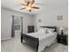 Spacious bedroom with a sleigh bed and ceiling fan at 19270 Briarbrook Dr, Tampa, FL 33647