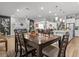 Open concept dining area with a large wooden table and seating for six at 19270 Briarbrook Dr, Tampa, FL 33647