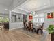 Elegant dining room with a chandelier, large table, and access to the kitchen at 19270 Briarbrook Dr, Tampa, FL 33647