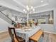 Open concept dining room with a view of the kitchen and staircase at 19270 Briarbrook Dr, Tampa, FL 33647