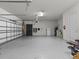 Spacious garage with epoxy flooring and ample storage at 19270 Briarbrook Dr, Tampa, FL 33647