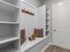 Inviting hallway with built-in bench seating and storage at 19270 Briarbrook Dr, Tampa, FL 33647