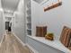Inviting hallway with built-in bench seating and storage at 19270 Briarbrook Dr, Tampa, FL 33647