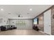 Spacious living room with luxury vinyl flooring, wood accent wall, and comfortable seating area at 19270 Briarbrook Dr, Tampa, FL 33647