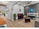 Elegant living area with hardwood floors, piano, and fireplace at 19270 Briarbrook Dr, Tampa, FL 33647