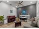 Spacious living room featuring a piano, comfy seating, and a decorative fireplace at 19270 Briarbrook Dr, Tampa, FL 33647