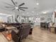 Open concept living room with a view of the kitchen and dining area at 19270 Briarbrook Dr, Tampa, FL 33647